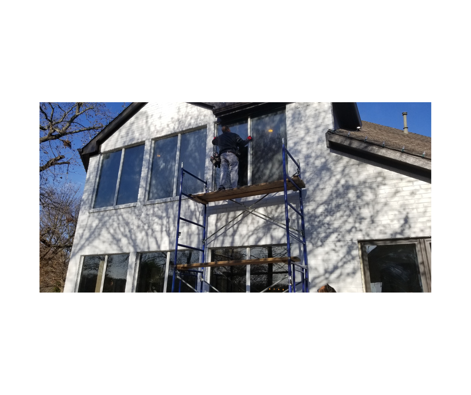 Window contractor working on house